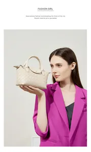 Detail of hand-woven cream leather bag featuring flap closure and rolled handle