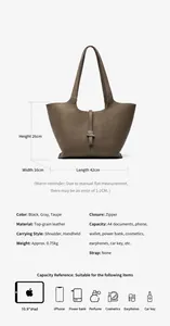 Dettaglio della grande borsa tote in pelle marrone con dimensioni e capacità interna