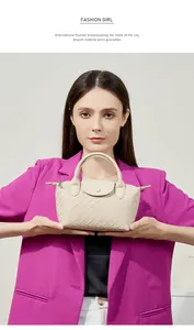 Detailed view of beige woven leather tote with crossbody strap and magnetic clasp closure