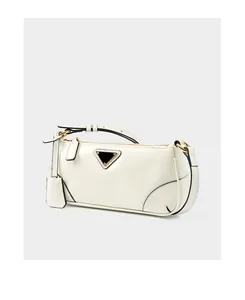 Detailed close-up of white leather shoulder bag with golden zipper and triangle logo