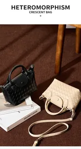 Detail showing the intricate woven texture and leather snap closure on the crescent bag