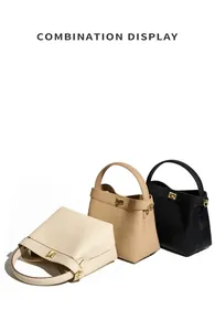 Combination display of leather bucket bags with gold twist locks in beige, tan, and black