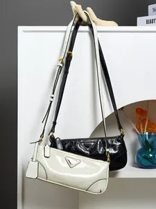 Minimalist oil wax leather shoulder bag for women in black and beige finishes