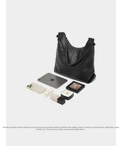 Top view of large black leather tote bag showcasing its spacious capacity for iPad and phone