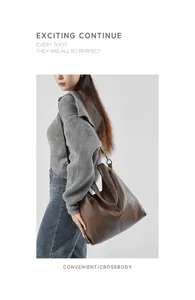 Brown leather tote bag with pebble texture shown on model for a stylish urban look