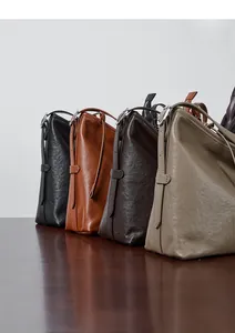Macro shot of four colors of soft leather tote bags with elegant silver buckles
