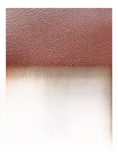Close-up of red-brown oil wax genuine leather with a fine lychee grain texture