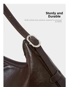 Detail of durable cowhide leather strap with silver buckle and neat stitching