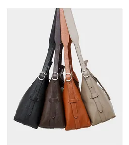 Multiple colors of high-quality leather tote bags with wide straps and metal buckles