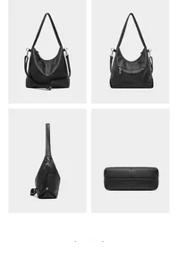 Detail view of black lychee grain leather tote bag showing pockets and stitching