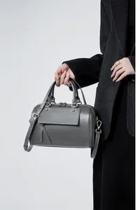 Charcoal grey Boston leather handbag detail with champagne gold hardware and shoulder strap