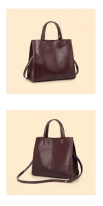 Detail view of burgundy leather tote showing sturdy top handles and adjustable shoulder strap