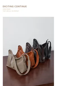 Detailed row of vintage leather tote bags in beige, brown, and black on a wooden desk