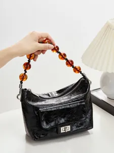 Sac à épaule en cuir ciré vintage avec chaîne en perles d'ambre et design plissé