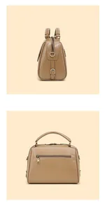 Detailansicht der braunen Boston-Tasche aus Leder mit Reißverschlusstasche und D-Ringen