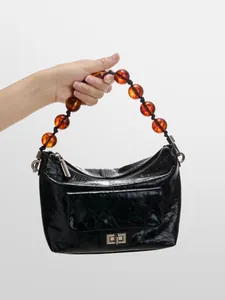 Sac à épaule vintage en cuir ciré avec plis et poignée en perles ambrées