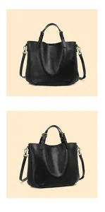 Dettagli della borsa tote in pelle nera con tracolla regolabile e finiture in bronzo antico
