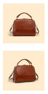 Detailansicht der braunen Lederhandtasche mit goldenen Beschlägen und Griffen