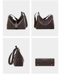 Detail view of large leather hobo bag showing the front, back, side, and riveted bottom