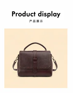 Detail of dark brown top grain leather handbag showing fine stitching and metal buckle