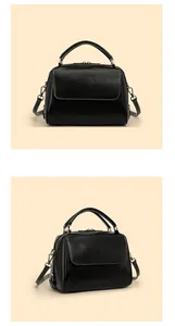 Detail der schwarzen Leder Boston Bag mit silbernen Reißverschlüssen und Griffen