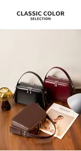 Classic selection of genuine leather handbags in black, burgundy, and dark brown colors