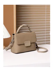 Detail of genuine leather shoulder bag with lychee texture and silver hardware