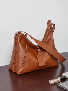 Vintage brown leather hobo shoulder bag with wide strap and large capacity for daily use