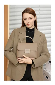 Brown lychee leather handbag featuring a flap design and square buckle details
