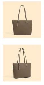 Detailed macro view of dark brown pebbled leather texture on a retro tote bag