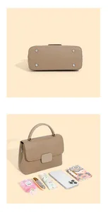 Detail view of khaki pebbled leather bag with metal feet and personal daily essentials
