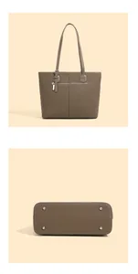 Detail of the brown lychee leather tote bag showing base metal studs and rear zipper pocket
