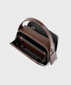 Top view of dark brown leather handbag showing interior compartments and zipper pockets