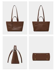 Viste dettagliate della borsa tote in pelle marrone con piedini in metallo