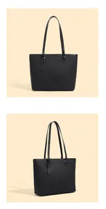Detail of black pebbled leather tote bag with silver metal buckle on the long shoulder strap