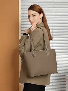 Retro brown lychee leather tote bag with adjustable strap for daily commute and casual style