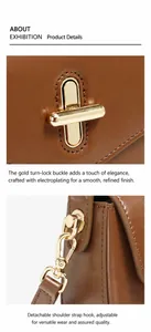 Detail of golden twist-lock closure and adjustable strap hooks on brown leather handbag