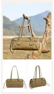 Close-up of olive green genuine leather texture and drawstring detail on handbag