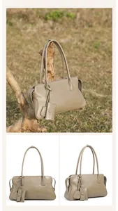 Detalle del bolso tote de cuero caqui con textura suave y correas de hombro vintage