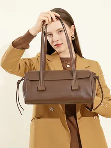 Vintage brown vegetable-tanned leather baguette shoulder bag for stylish commuting