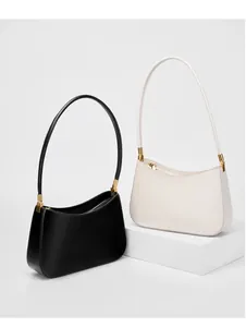 Minimalist leather hobo bags in black and cream white with elegant gold metal hardware