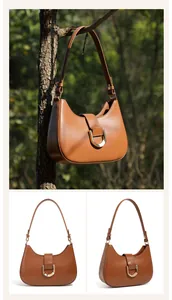Detail einer karamellbraunen Hobo-Tasche aus Leder mit goldener Schnalle am Zweig