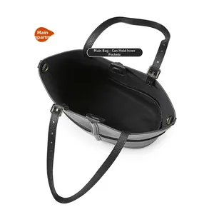 Internal view showing the spacious capacity of this black leather tote with adjustable straps