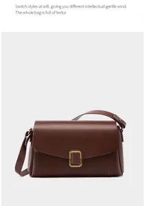 Detail of dark brown leather handbag featuring a square golden buckle and flap closure
