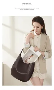 Detail of dark brown leather tote bag showing large capacity for A4 magazines