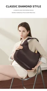 Macro view of textured chocolate brown leather tote bag with elegant hobo crescent shape