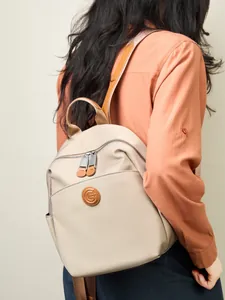 Chic beige oxford cloth and leather backpack for women, spacious and lightweight for commuting