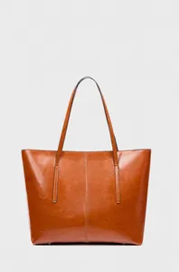 Detail view of large brown leather tote bag with vertical stitching and glossy oil-wax finish