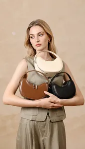 Three colors of premium first layer cowhide dumpling bags shown with fine leather texture