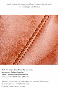 Close-up of brown textured leather showing precise stitching on high-quality tote bag